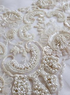 Hand-made wedding trim beaded richly with pearls ribbons and | Etsy Elegant Embellished Embroidered Fabric For Mother Of The Bride, Elegant Embellished Fabric For Mother Of The Bride, Elegant Pearl Embroidered Fabric For Celebration, Elegant Embroidered Fabric For Celebration, Elegant Embellished Embroidered Fabric For Ceremony, Elegant White Embroidered Fabric For Celebrations, Elegant Embellished Bridal Accessories For Ceremony, Elegant White Beaded Embroidered Fabric, Elegant Embroidered Fabric With Pearl Embroidery For Reception