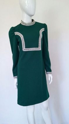 Classic 70's  DressEmerald green polyester material with white lace detailings.Size MediumExcellent ConditionZip backEmail for specific measurements Green Lined Vintage Dress, Green Fitted A-line Vintage Dress, Retro Green Lined Vintage Dress, 1970s Green Long Sleeve Dress, 1970s Style Green Long Sleeve Dress, 70's Dress, Dress Emerald Green, Emerald Green Dress, Snakeskin Boots