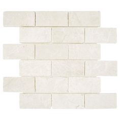 a white brick wall that is made out of marble