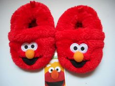 Your little Elmo fan will absolutely love these vibrant red Elmo slippers. These Super soft and comfortable slippers are easy to put on. Your child will feel independent being able to put on their own slippers. The perfect slip on slippers with a durable fabric outsole for extra traction and a bright red Elmo color. Elmo’s face Is largely printed on front of slipper will make your toddler smile. These Sesame Street Elmo’s Slippers are fun to wear. Unique design Sesame Street Slippers Super soft Elmo Slippers, Elmo Characters, Sesame Street Elmo, Slip On Slippers, Plush Slippers, Infant Boys, Comfortable Slippers, Dr Pepper, House Shoes