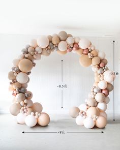 the letter o made out of balloons is shown in front of a wall with measurements