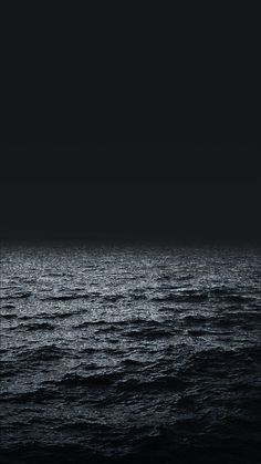 the ocean is very dark and empty at night