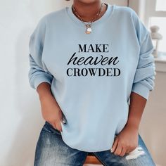 Make Heaven Crowded Sweatshirt. Looking for an intentional way to share your faith? This awesome Christian sweatshirt is super soft, warm and sure to turn heads. Pair it with jeans or joggers for a Christian streetwear style. Make a bold faith statement in a stylish way with cool Christian sweatshirts and hoodies. Wearing trendy Christian clothes that stand out in a crowd is a simple way to express your faith. Of all this things on your to do list, making heaven crowded should be at the top of t Inspirational Slogan Sweatshirt For Fall, Inspirational Streetwear Tops For Fall, Inspirational Text Print Sweatshirt For Fall, Inspirational Text Print Fall Sweatshirt, Inspirational Slogan Sweatshirt In Relaxed Fit, Inspirational Text Print Sweatshirt With Relaxed Fit, Faith Shirts, Christian Sweatshirts, Make Heaven Crowded