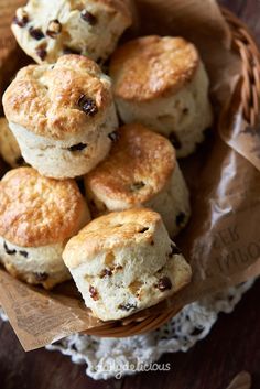 a basket full of biscuits sitting on top of a table