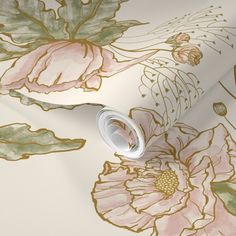 a wallpaper with pink and green flowers on it's side, next to a roll of tape