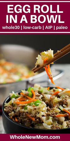 an egg roll in a bowl with carrots, cabbage and other vegetables being served