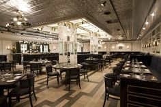 an empty restaurant with tables and chairs