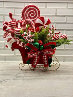 a red wagon filled with candy canes and candies