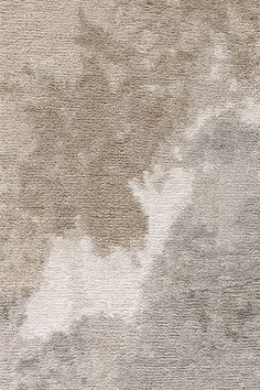 an area rug with various shades of gray and white on the floor, including clouds