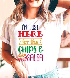 This "I'm Just Here For The Chips & Salsa" design is the perfect, fun Cinco De Mayo shirt for anyone that loves drinks and to celebrate! Cinco De Mayo Funny Print Crew Neck Top, Fun Graphic Print T-shirt For Cinco De Mayo, Funny Multicolor Top With Text, Multicolor Funny Tops With Text, Fun Short Sleeve Tops For Cinco De Mayo, Fun Cotton Tops For Cinco De Mayo, White Graphic Print Tops For Cinco De Mayo, White Letter Print Tops For Cinco De Mayo, Multicolor Letter Print Tops For Cinco De Mayo