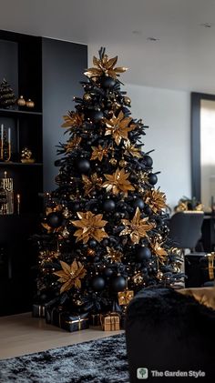 a black and gold christmas tree in a living room