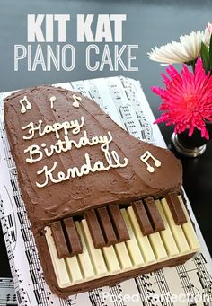 a birthday cake that is shaped like a piano