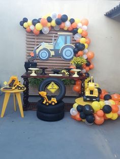 a tractor themed birthday party with balloons and decorations