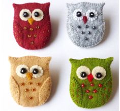 four felt owl brooches in different colors