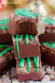 several pieces of chocolate with green icing on them