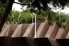 a skateboarder is doing a trick in the air on a ramp at a skate park