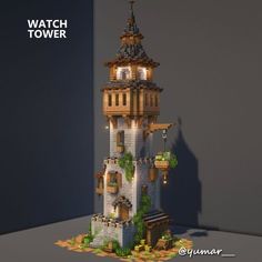 a tall tower made out of legos with plants growing on the top and below it