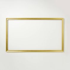 an empty gold frame hanging on the wall