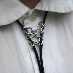 Bolo Tie by Garage Bands. Sterling silver and fabric band SPLITOne size, adjustable SPLITThis item is produced on a made-to-order basisand will be shipped within 2-3 weeks from Australia. Australia shipping: £10Global shipping: £25 Silver Bolo Tie, Bolo Tie Diy, Megan Aesthetic, Western Punk, Tie Jewelry, Dope Jewelry Accessories