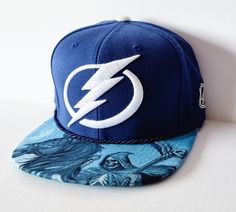 Custom Hand-made brim Official NHL Mitchell & Ness Tampa Bay Lightning snapback hat. You will get the hat exactly the one on this listing. Usually ships within 24 hours with a priority mail service. ( Not including weekends and holidays ). Please send a message if you need to upgrade your delivery service. Adjustable Snapback Hat For Fan Merchandise, Adjustable Snapback Hat With Flat Bill For Fans, Adjustable Flat Bill Snapback Hat For Fan Merchandise, Adjustable Snapback Fitted Hat For Fans, Adjustable Snapback Hat For Fans, Adjustable Flat Bill Snapback Hat For Fans, Adjustable Flat Bill Hats For Fan Merchandise, Adjustable Flat Bill Hat For Fan Merchandise, Curved Brim Fitted Hat For Fan Merchandise