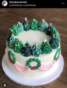 a decorated christmas cake sitting on top of a white plate