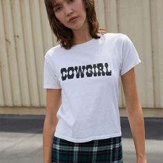 Soft And Lightweight Crewneck Cotton Top In White With The Black Cowgirl Graphic On The Front. Fabrics: 100% Cotton Measurement: 53 Cm Length, 43 Cm Bust Made In: Europe Brandy Melville Graphic Tees, Cowgirl Graphic, Tops Brandy Melville, Black Cowgirl, Brandy Melville Shorts, Floral Tee, Graphic Tee Shirt, Brandy Melville Tops, White Crop Top