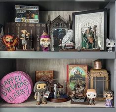 the shelves are filled with figurines, books and other collectibles for halloween