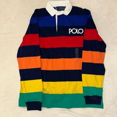 Brand New Polo Ralph Lauren Spectre Rainbow Striped Rugby Jersey Shirt. Mens Size Large $105 Multicolor Tops With Casual Collar For Fall, Casual Multicolor Polo Collar Shirt, Navy Long Sleeve Color Block Top, Navy Color Block Collared Top, Multicolor Collared Color Block Tops, Classic Multicolor Long Sleeve Tops, Navy Collared Color Block Top, Fitted Multicolor Polo Collar Top, Classic Multicolor Fall Top