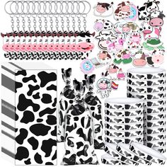 cow themed party supplies including plates, cups and napkins