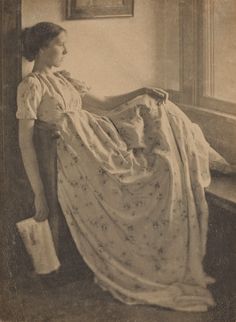 an old photo of a woman laying down