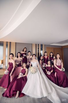 a bride and her bridal party posing for a photo