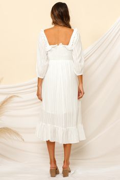 We're dreaming of magical moments wandering the streets of Venice in our Loved By The Moon Midi Dress! Style yours with vintage boots and a rancher hat! Floaty midi dress. true to size Square neckline Can be worn on or off the shoulder 3/4-length sleeve Shirring along bodice Frill trimming on hem No zipper. slip-on style Partially lined Lightweight. 100% cotton Non-stretchy material Cold hand wash only Model wears XS Length from shoulder to hem: 132cm on an S Streets Of Venice, Backless Midi Dress, Midi Dress White, Corset Midi Dress, Rancher Hat, Draped Midi Dresses, Midi Dress Style, Yellow Midi Dress, Chiffon Midi Dress