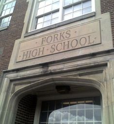 the front entrance to forks high school, which is located on an old brick building