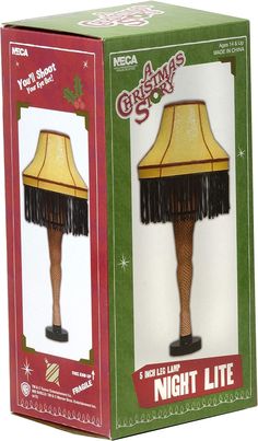 a christmas story night lite lamp in the box with it's light on