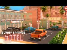 an animated image of a motel with cars parked in the parking lot and palm trees