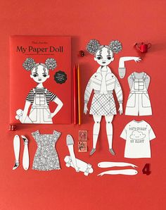 the paper doll has been cut out to look like it is being displayed on a red surface