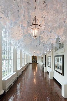 the instagram page shows an image of a hallway with chandelier hanging from the ceiling