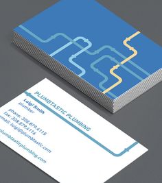 two business cards with blue and yellow lines on the front, one is for plumbing