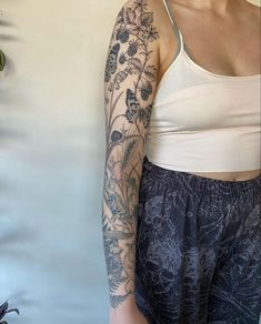 a woman with a tattoo on her arm