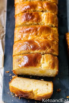 sliced loaf of bread sitting on top of a cutting board