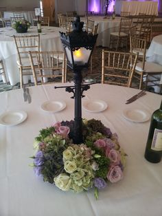 the table is set with flowers and candles for an elegant wedding reception at the hotel