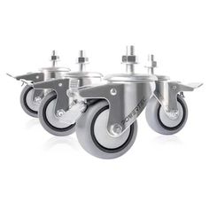 four metal casteors with black wheels on a white background