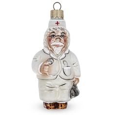 a glass ornament with a nurse figure on it's head and holding a handbag