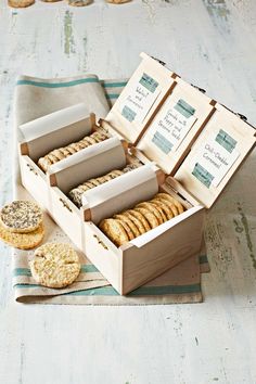 an open wooden box filled with cookies and crackers