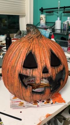 a carved pumpkin sitting on top of a table