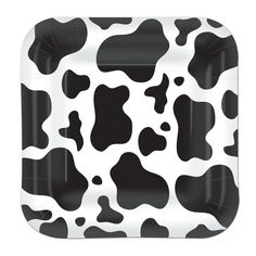 a black and white cow print paper plate