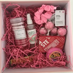 a pink box filled with lots of different items