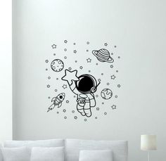 an astronaut is flying through the space wall decal