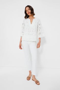 The White Eyelet Lace Florian Blouse is your new summer staple. Crafted from cotton, this top has an elegant notched neckline with stitch detailing, capacious three-quarter length sleeves and an eyelet floral design that leads into a scalloped cuffs and hem. Pair with a white denim and strappy sandals for a chic mono-tone look that will turn heads. Notched neckline Trapunto stitching at collar Three-quarter length bell sleeves Scalloped cuffs and hem Slightly boxy Embroidered lace fabric Lined b Summer Style Guide, Notched Neckline, Embroidered Lace Fabric, Blouse Sale, Plus And Minus, Cocktail Attire, White Eyelet, Eyelet Lace, Summer Staples