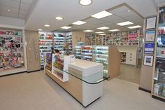 the inside of a pharmacy store with shelves full of medicine and other medical supplies on display